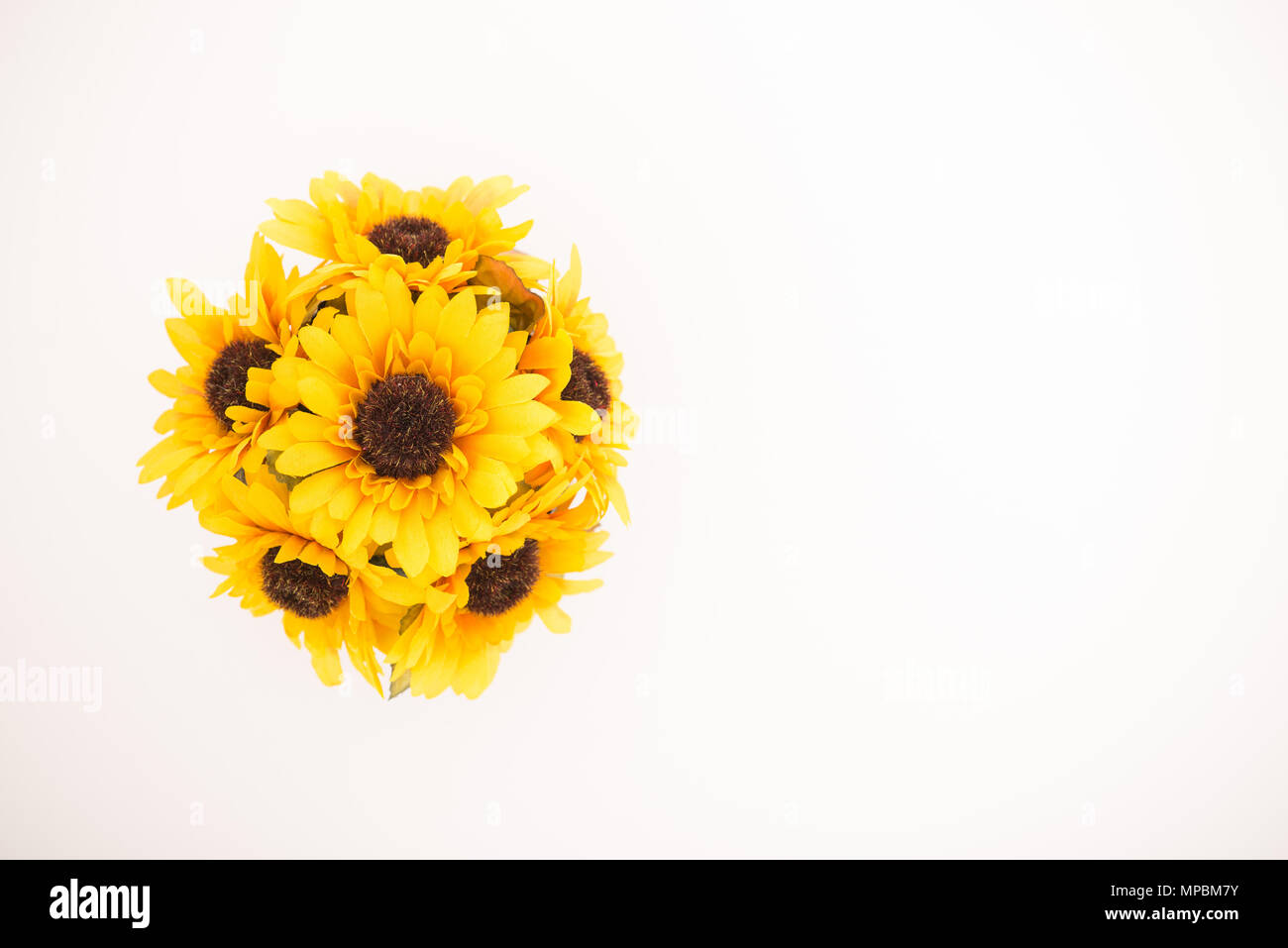 Reusable artificial flowers made from cloth and plastic. Stock Photo