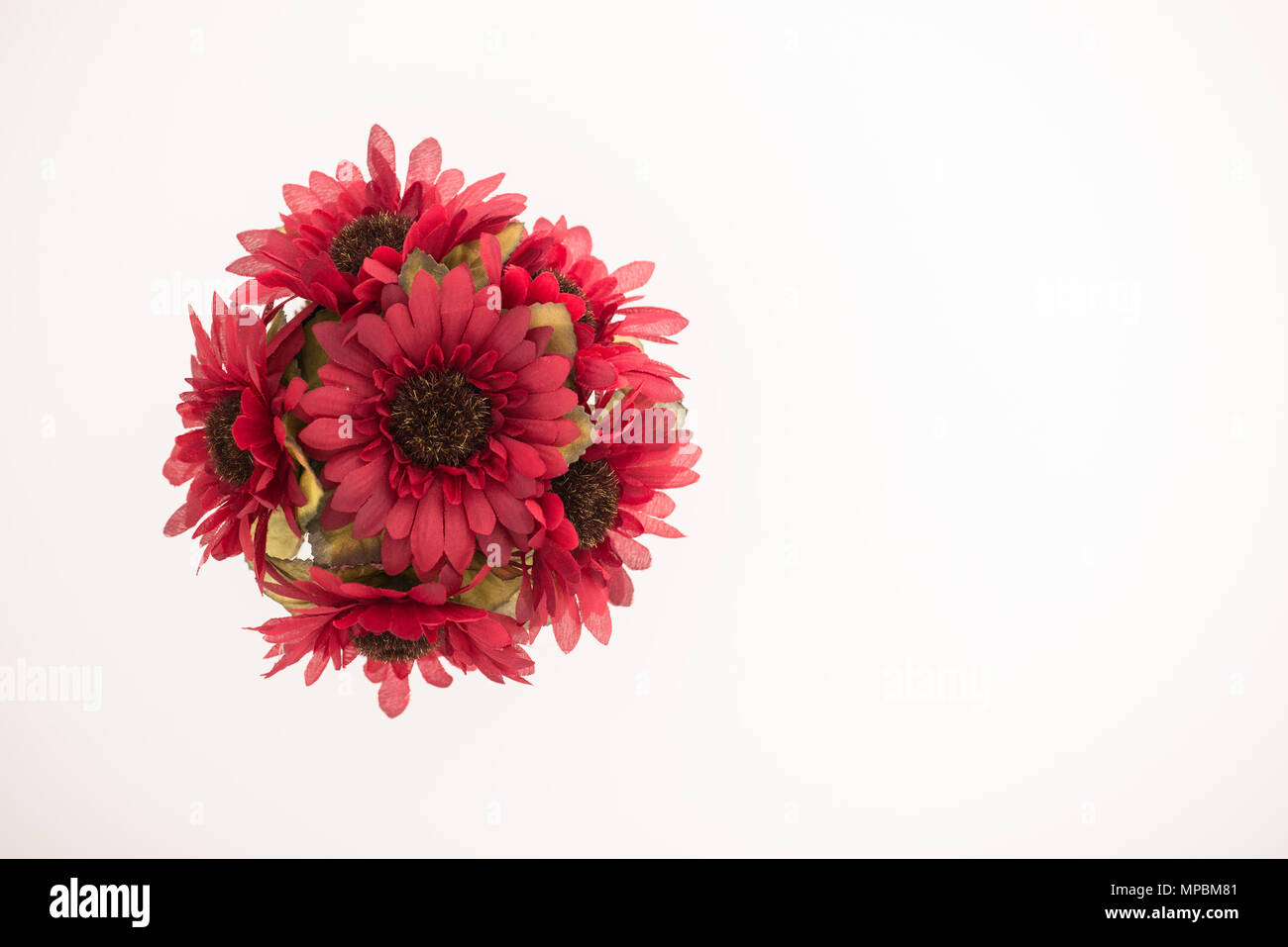 Reusable artificial flowers made from cloth and plastic. Stock Photo