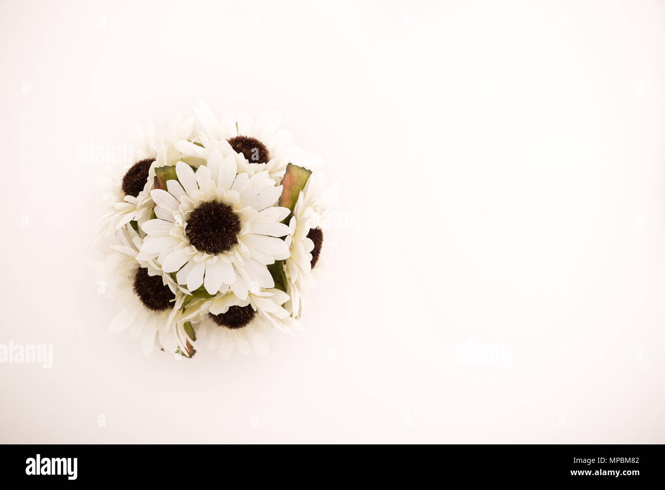 Reusable artificial flowers made from cloth and plastic. Stock Photo