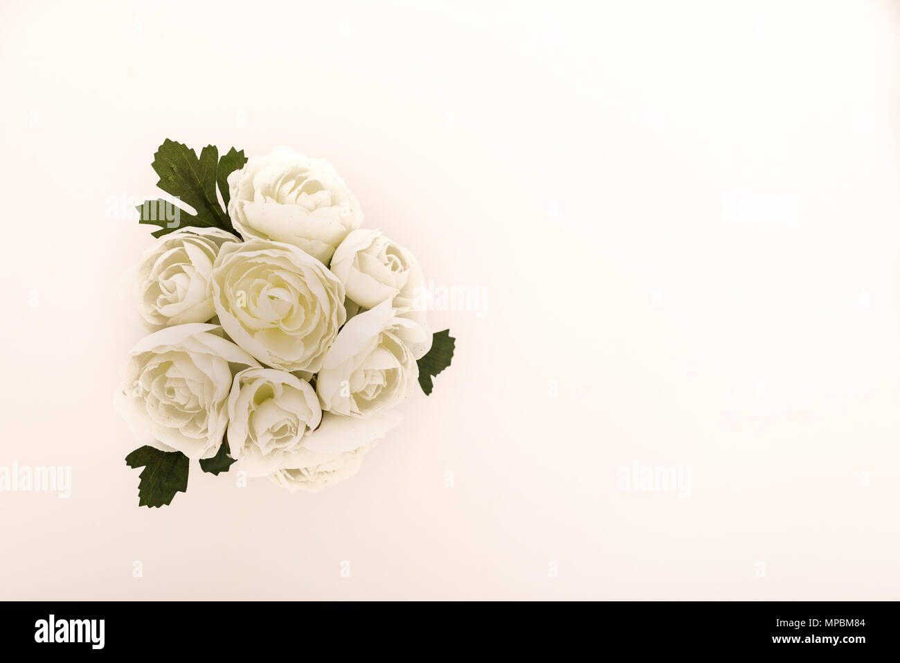 Reusable artificial flowers made from cloth and plastic. Stock Photo