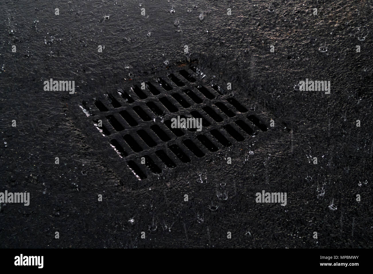 Storm drain during a torrential downpour in Foley, Alabama, USA Stock Photo