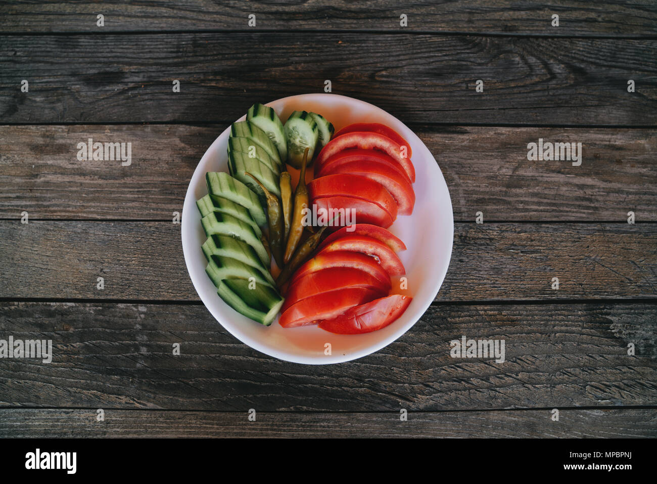 Vegetables on plate over wooden table . Diet concept. Stock Photo