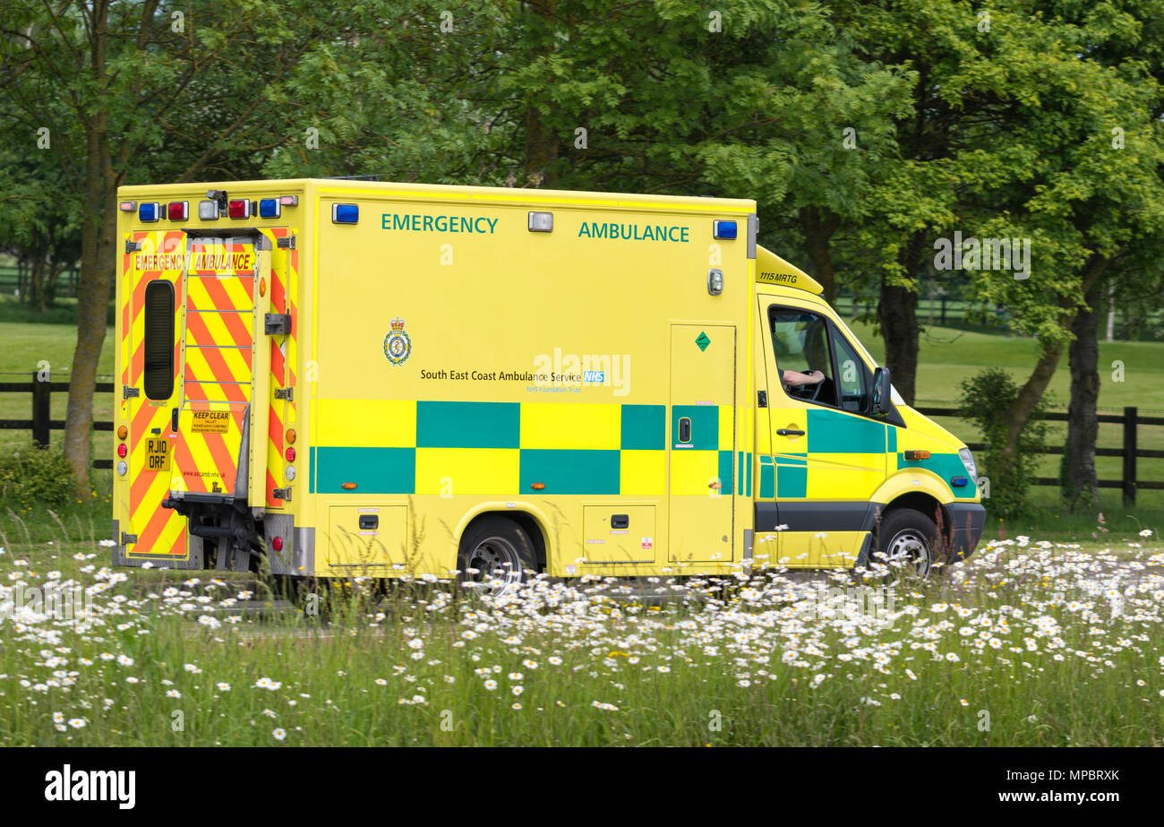 British NHS ambulance from the south east coast ambulance service on a road in West Sussex, England, UK. Mercedes Benz Sprinter 519 CDI from 2010. Stock Photo