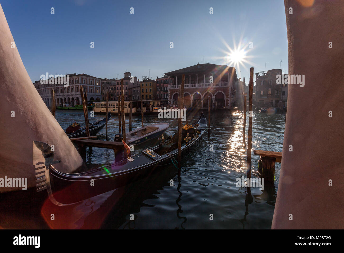 VENICE, ITALY - JANUARY 02 2018: Gondola moored between two hands of the Lorenzo Quinn sculpture in the Canal Grand Stock Photo
