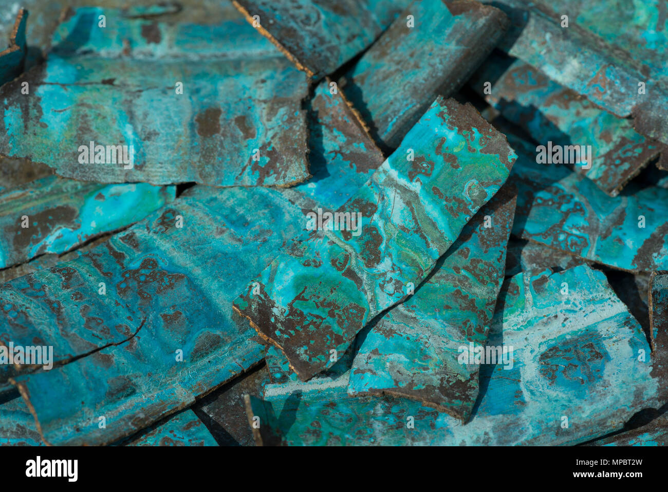 Weathered old metallic brass chemical reaction with elements and salts