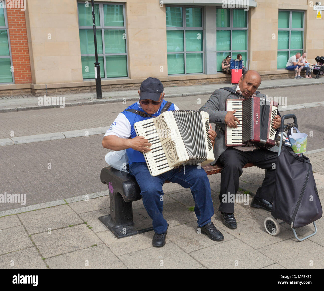 Two accordion players on market day at the Quayside,Newcastle,England
