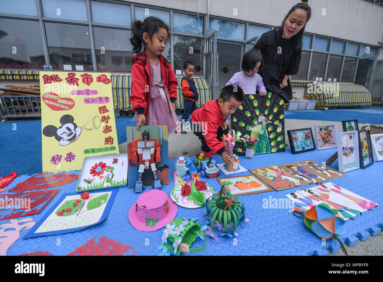 Children Arrange Paper Cuttings And Handicrafts In A Charity Bazaar During Campus Cutting Festival At Kindergarten Changxing County Children Arrange Paper Cuttings And Handicrafts In A Charity Bazaar During Campus Cutting Festival At Kindergarten Changxing County