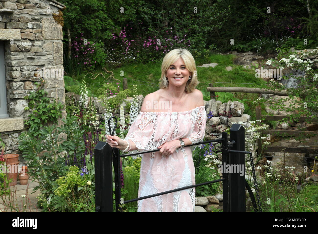 Chelsea, London, UK. 21st May, 2018. Chelsea, London, UK. 21st May 2018. Anthea Turner on the Welcome to Yorkshire garden at Chelsea Flower Show 2018, designed by Mark Gregory for Landformconsultants.co.uk Credit: Jenny Lilly/Alamy Live News Stock Photo