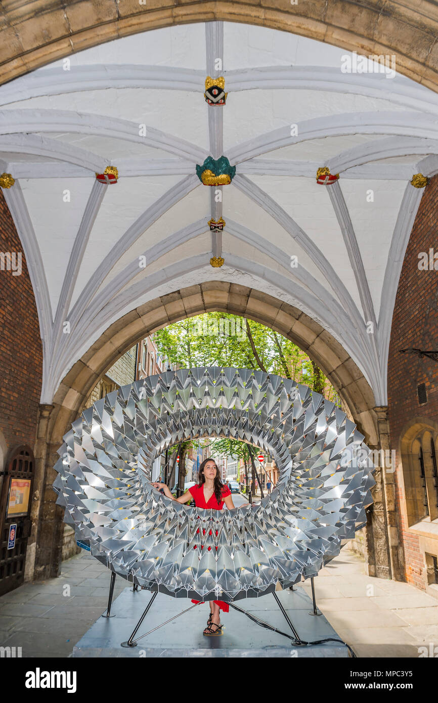 London, UK. 22nd May, 2018. Royal Approval the biggest Elizabethan ruff ever created - made from sheet aluminium folded in an origami way, it has been created by Kinetech Design in collaboration with Amari Interiors and Timberfusion. It is in St John's Gate which saw the first performances of some of Shakespeare's most famous works - Outdoor installations for Clerkenwell Design Week, which starts today. Credit: Guy Bell/Alamy Live News Stock Photo