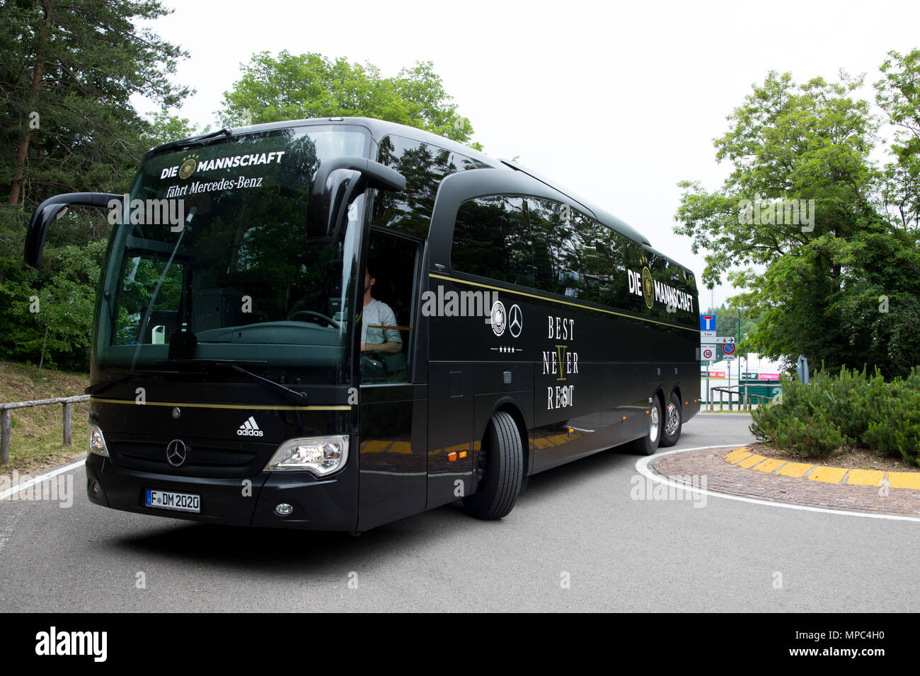 22 May 2018, Italy, Eppan: The team bus manoeuvres outside the training grounds at the sport centre Rungg during a test drive. The German soccer national team will prepare for the World Cup 2018 in Russia at their training camp near Bozen from 23 May to 07 June 2018. Photo: Christian Charisius/dpa Stock Photo