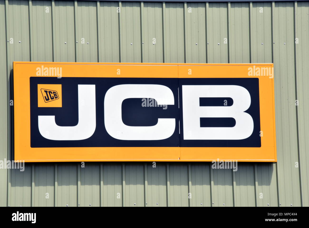 21 May 2018, Germany, Frechen near Cologne: The logo of the British manufacturer of construction, industrial and agricultural machinery JCB J.C. Bamford Excavators Limited at a branch. · NO WIRE SERVICE · Photo: Horst Galuschka/dpa/Horst Galuschka dpa Stock Photo