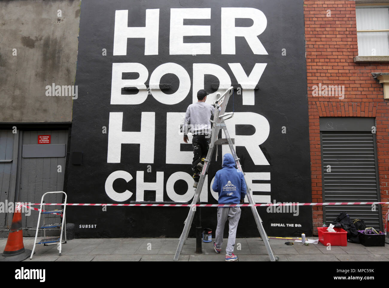 Dublin, Ireland. 22nd May 2018. Finishing touches are made to a pro-choice mural, by artist collective ‘Subset’, in Dublin city centre today ahead of this Friday’s Referendum on whether or not to repeal the Eighth Amendment of the Irish constitution dealing with abortion.  Credit: Laura Hutton/Alamy Live News Stock Photo