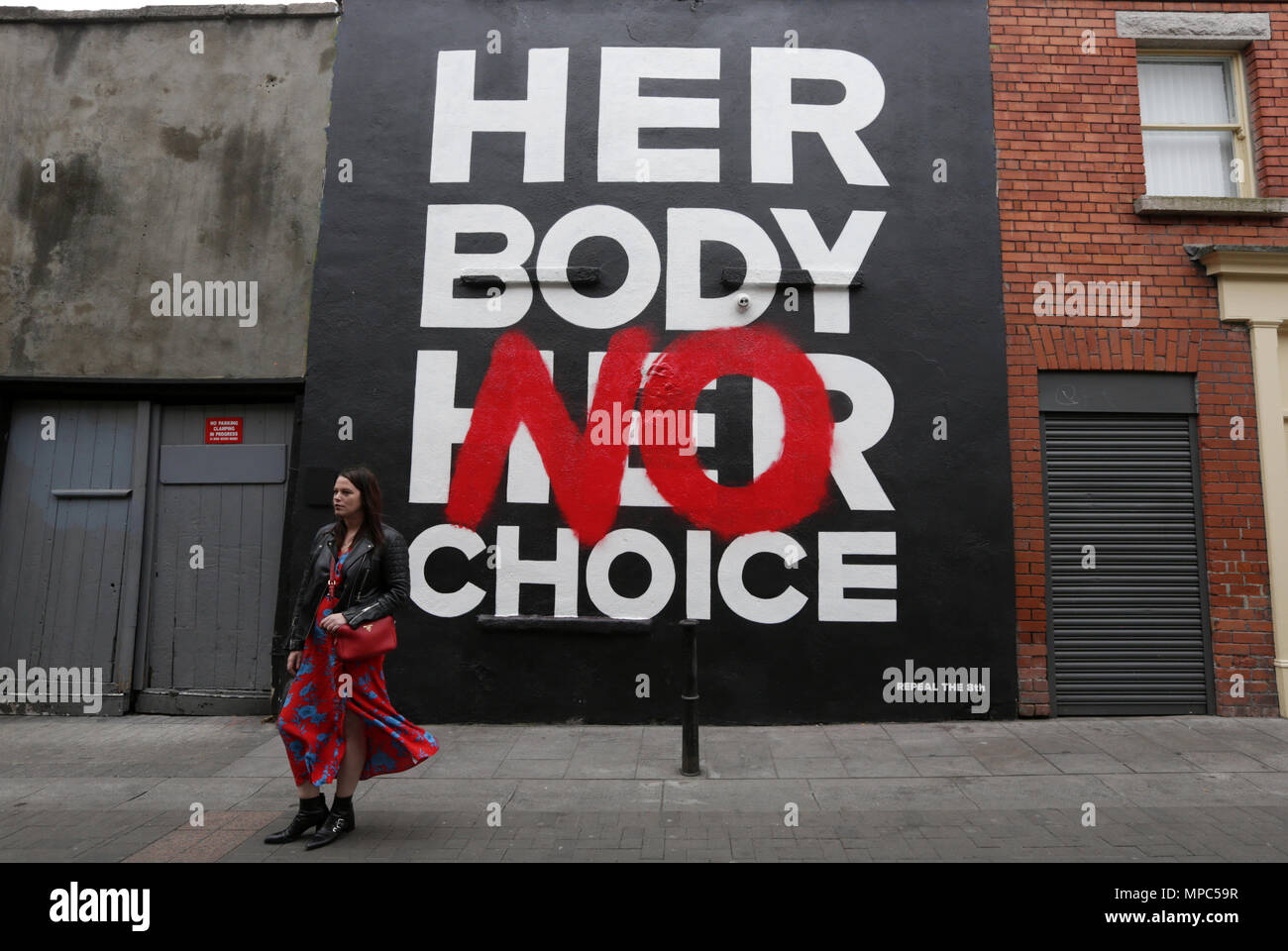 Dublin, Ireland. 22nd May 2018. A woman passes a pro-choice mural, by artist collective ‘Subset’, in Dublin city centre today ahead of this Friday’s Referendum on whether or not to repeal the Eighth Amendment of the Irish constitution dealing with abortion.  Credit: Laura Hutton/Alamy Live News Stock Photo