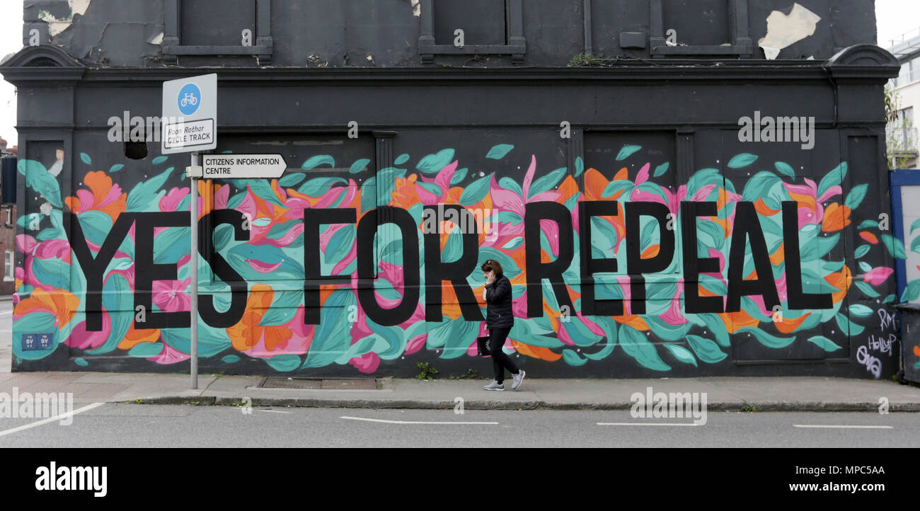 Dun Laoghaire, Ireland. 22nd May 2018. A woman walks past a Pro-Choice mural in Dun Laoghaire, Ireland, today ahead of this Friday’s Referendum on whether or not to repeal the Eighth Amendment of the Irish constitution dealing with abortion.  Credit: Laura Hutton/Alamy Live News Stock Photo