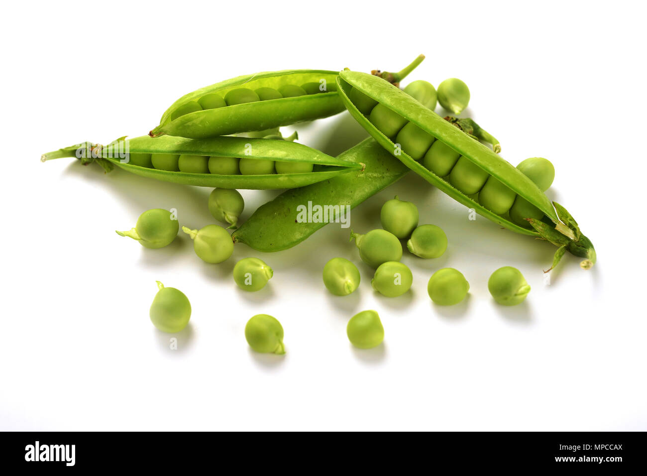 Pods of green peas isolated on a white background. Green ripe fresh