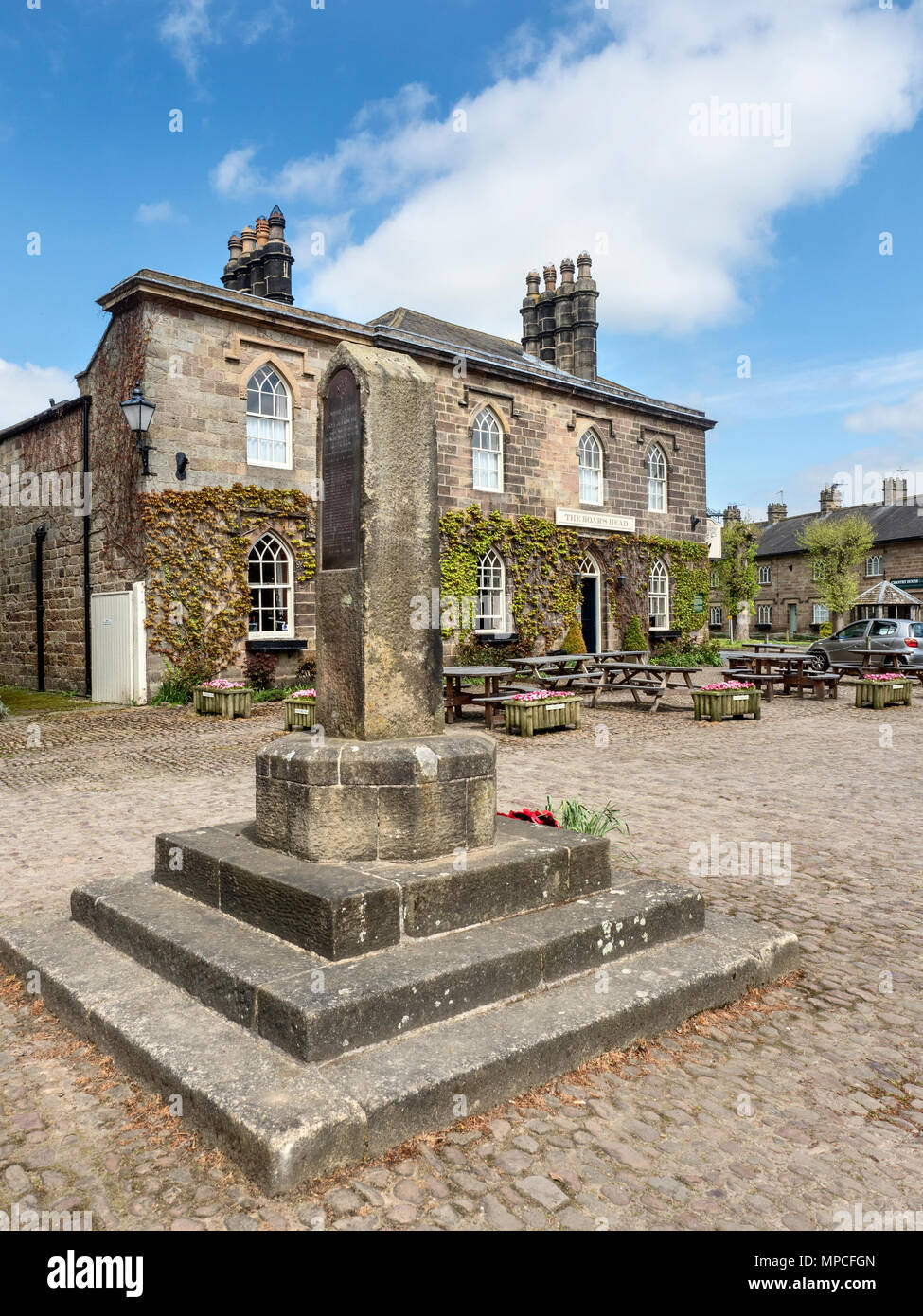 War Memorial and The Boars Head Pub at Ripley North Yorkshire England Stock Photo