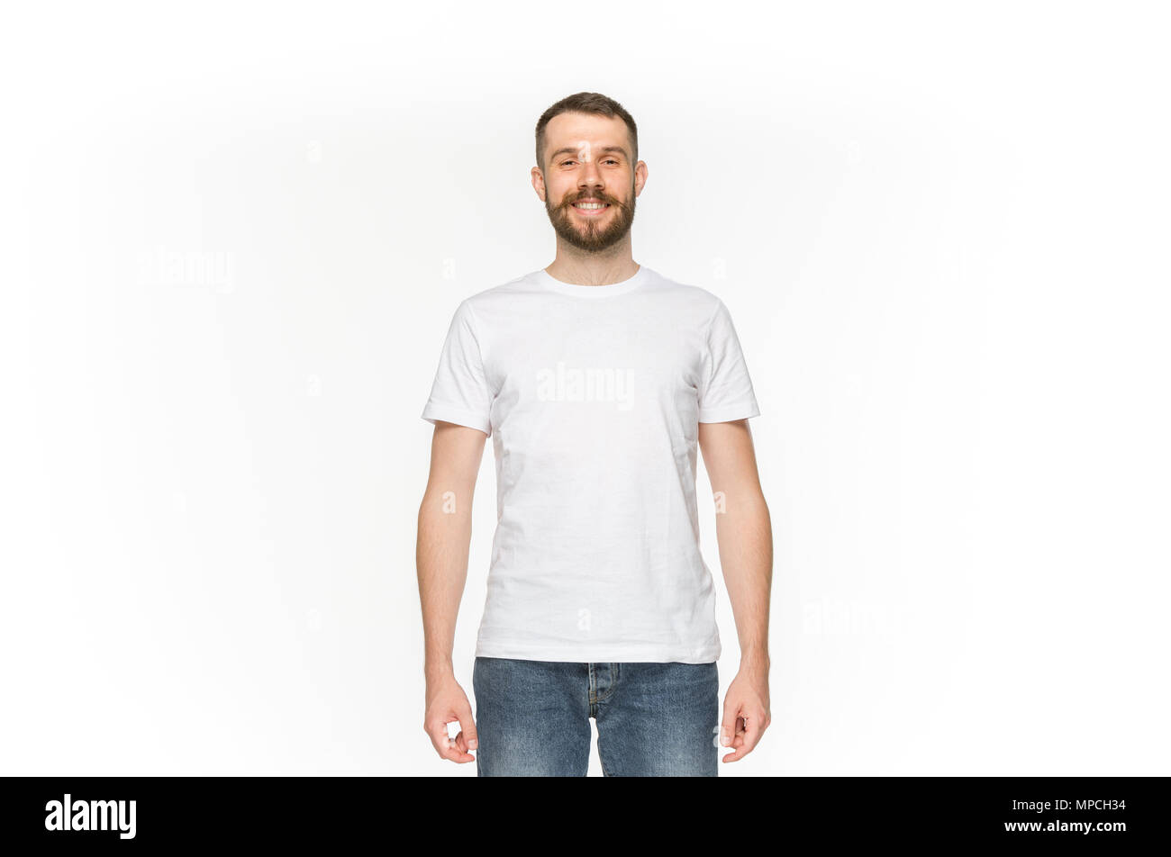 Closeup of young man's body in empty white t-shirt isolated on white background. Mock up for disign concept Stock Photo