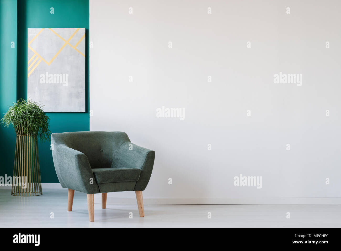 Minimalist Living Room Interior With Empty White Wall Green Armchair Plant And Painting Stock Photo Alamy