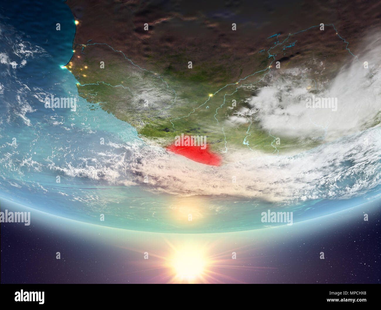 Liberia during sunrise highlighted in red on planet Earth with clouds ...