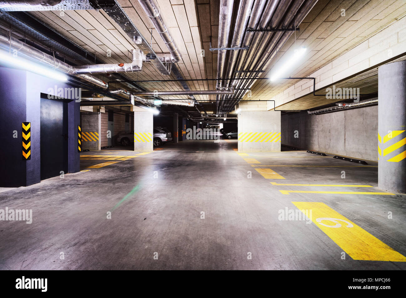 Underground Parking garage in a modern apartment building Stock Photo