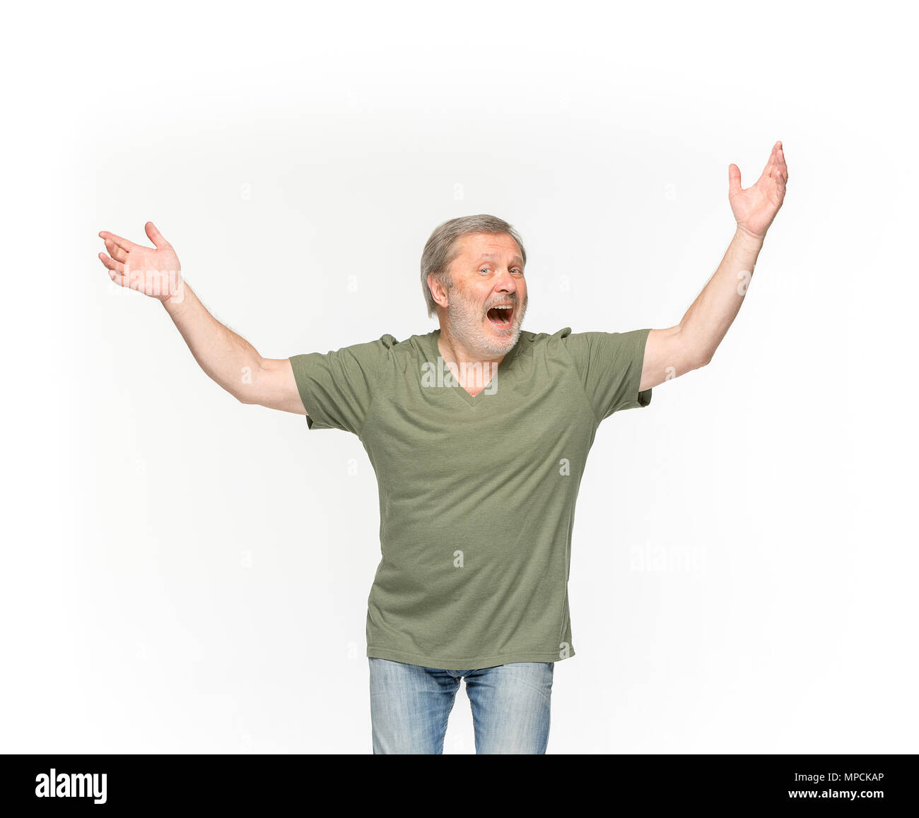 Closeup of senior man's body in empty green t-shirt isolated on white background. Mock up for disign concept Stock Photo