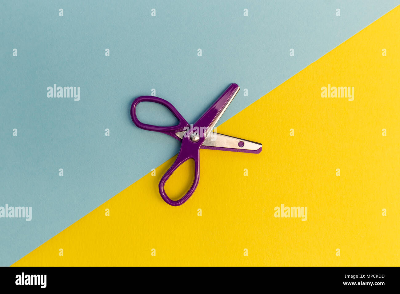 Scissors cutting paper line stationery concept Stock Photo