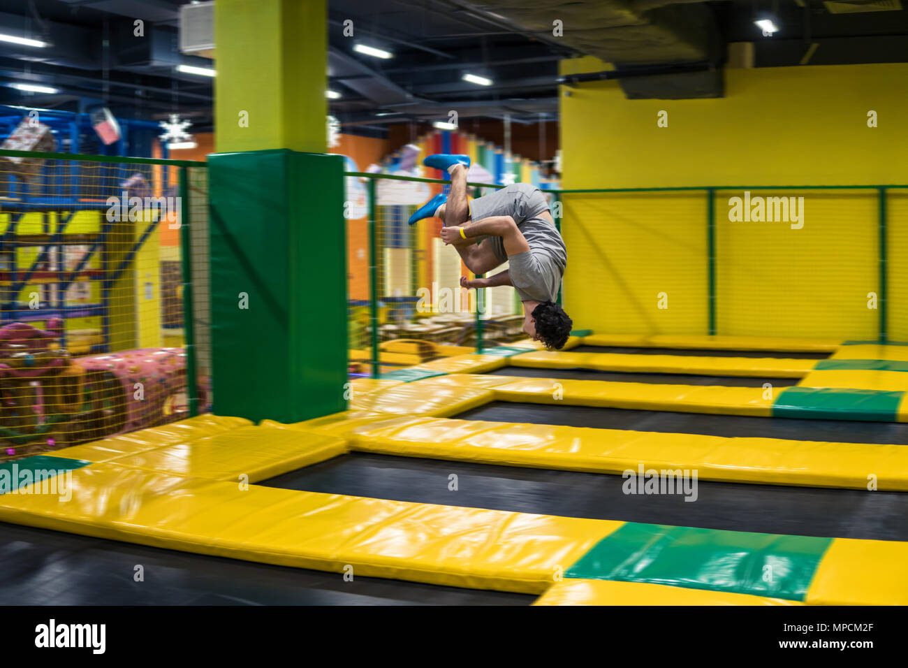 trampoline jumper performs acrobatic exercises on the trampoline Stock