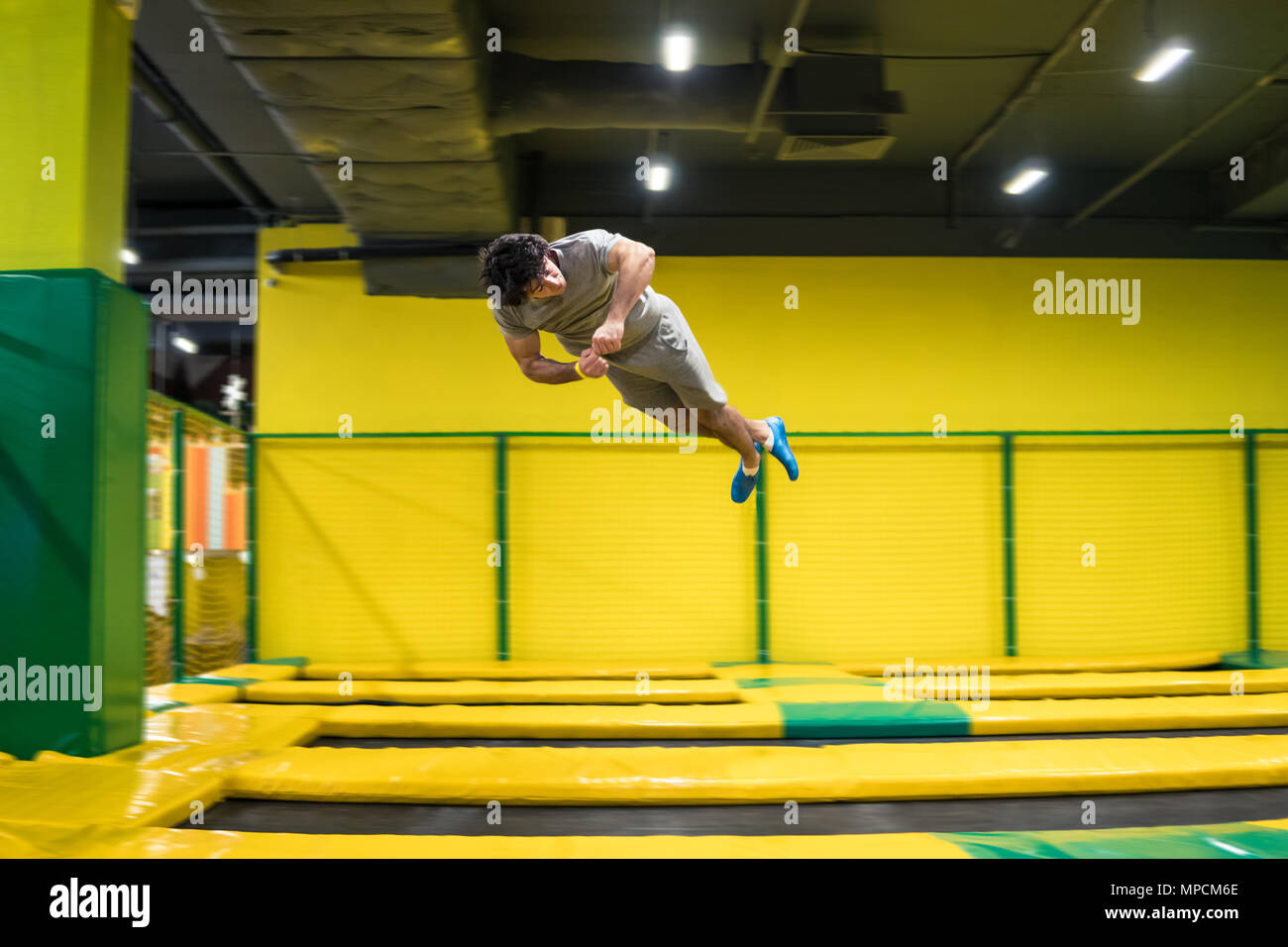 trampoline jumper performs acrobatic exercises on the trampoline Stock