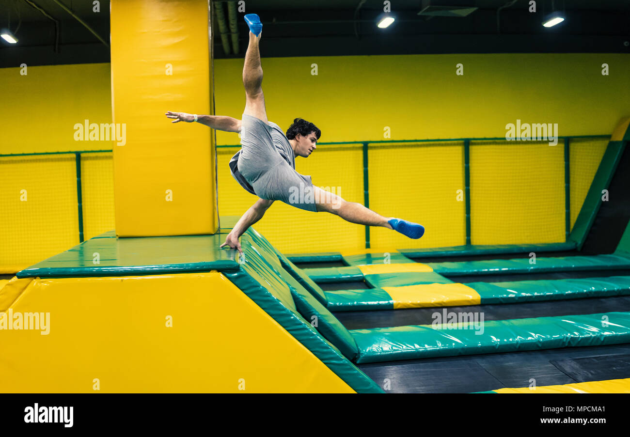 trampoline jumper performs acrobatic exercises on the trampoline Stock