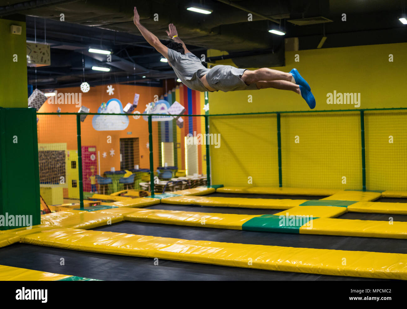 trampoline jumper performs acrobatic exercises on the trampoline Stock