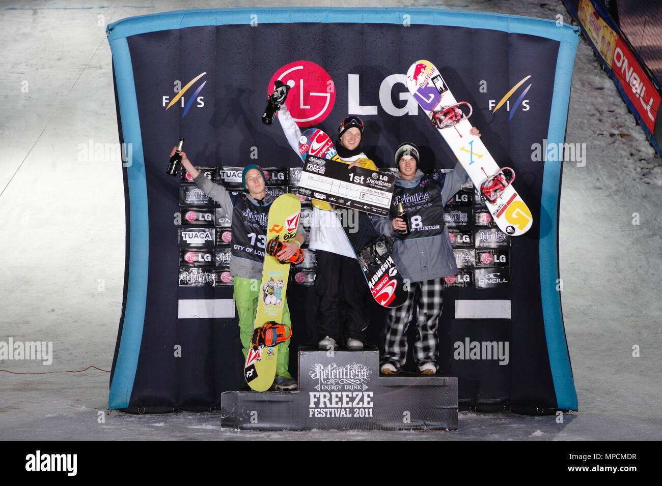UK Sport - Relentless Freeze Festival, Winners and places of the LG Snowboard FIS World Cup take position on the podium - 1st Janne Korpi FIN, 2nd Seppe Smits BEL and 3rd Joris Ouwerkerk NED. Battersea Power Station, London. 29 October 2011 Stock Photo