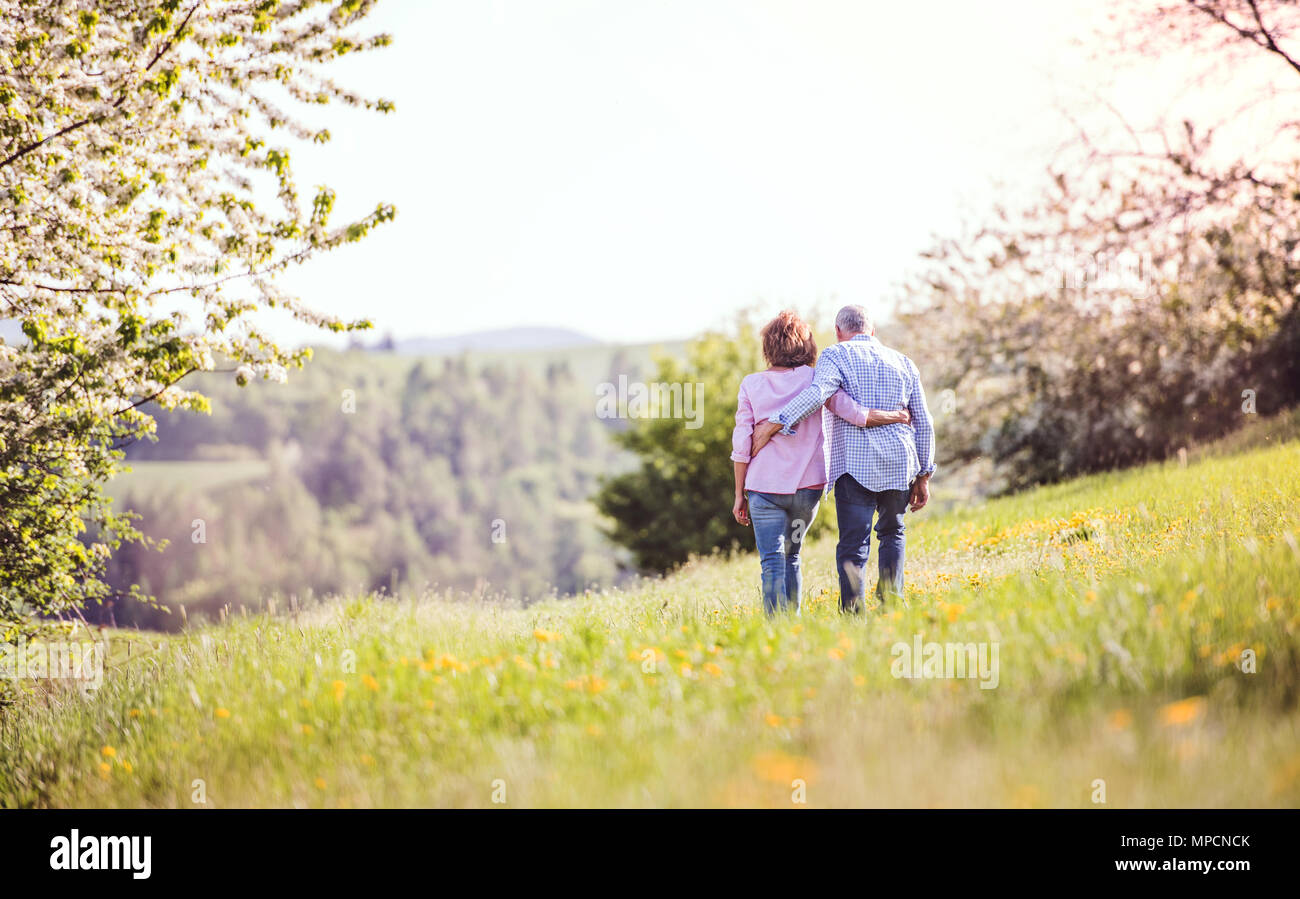 Old man woman walking arm hi-res stock photography and images - Alamy