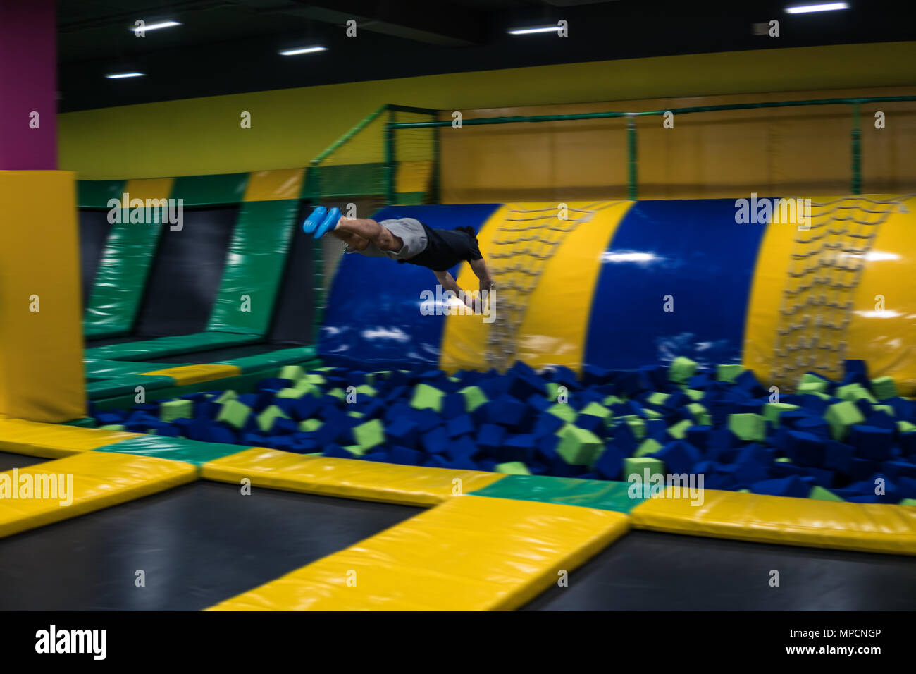 trampoline jumper performs acrobatic exercises on the trampoline Stock