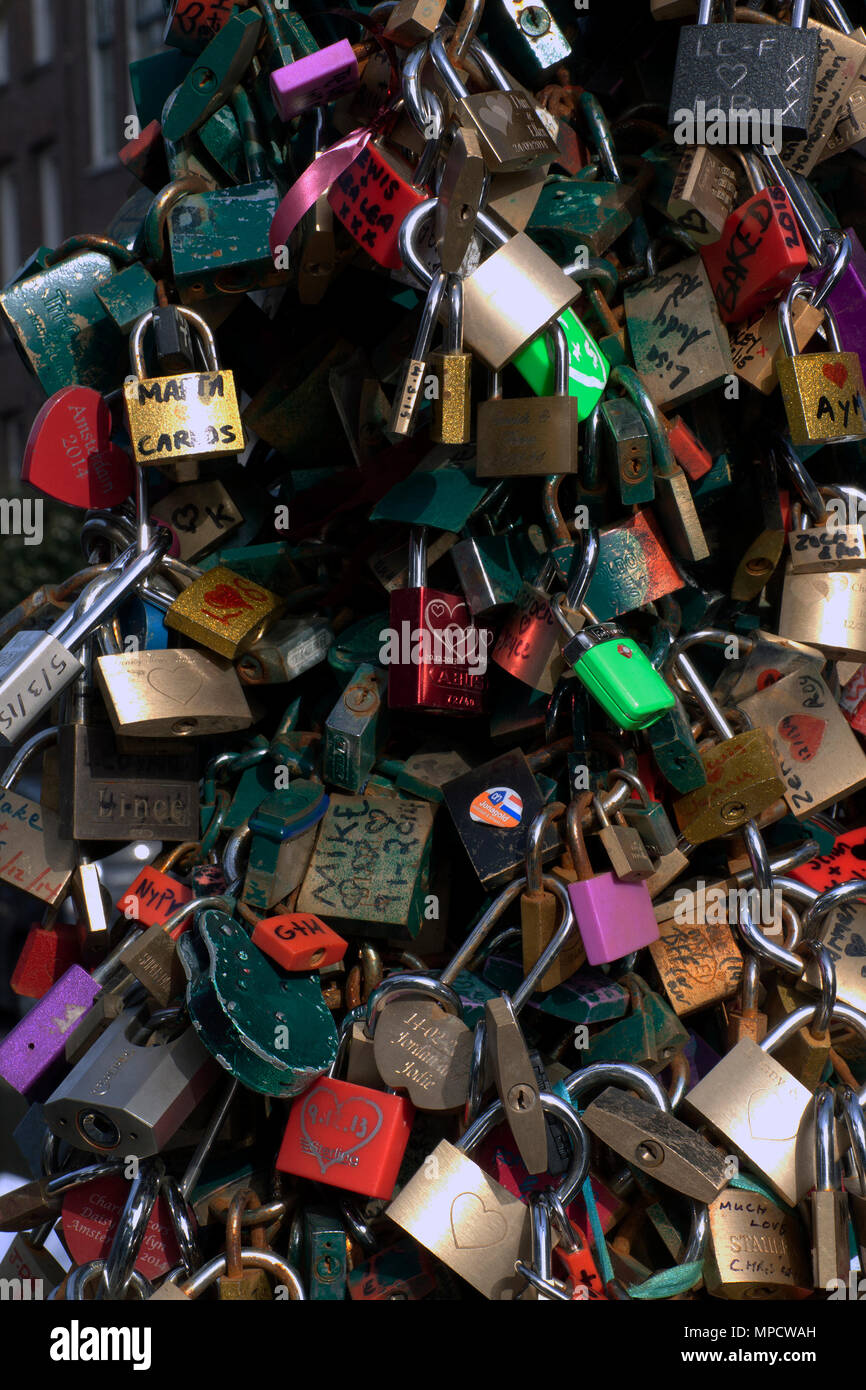Amsterdam,The Netherlands-march 7,2015: Lock at the bridge, key in the water: love bridge in Netherlands Stock Photo