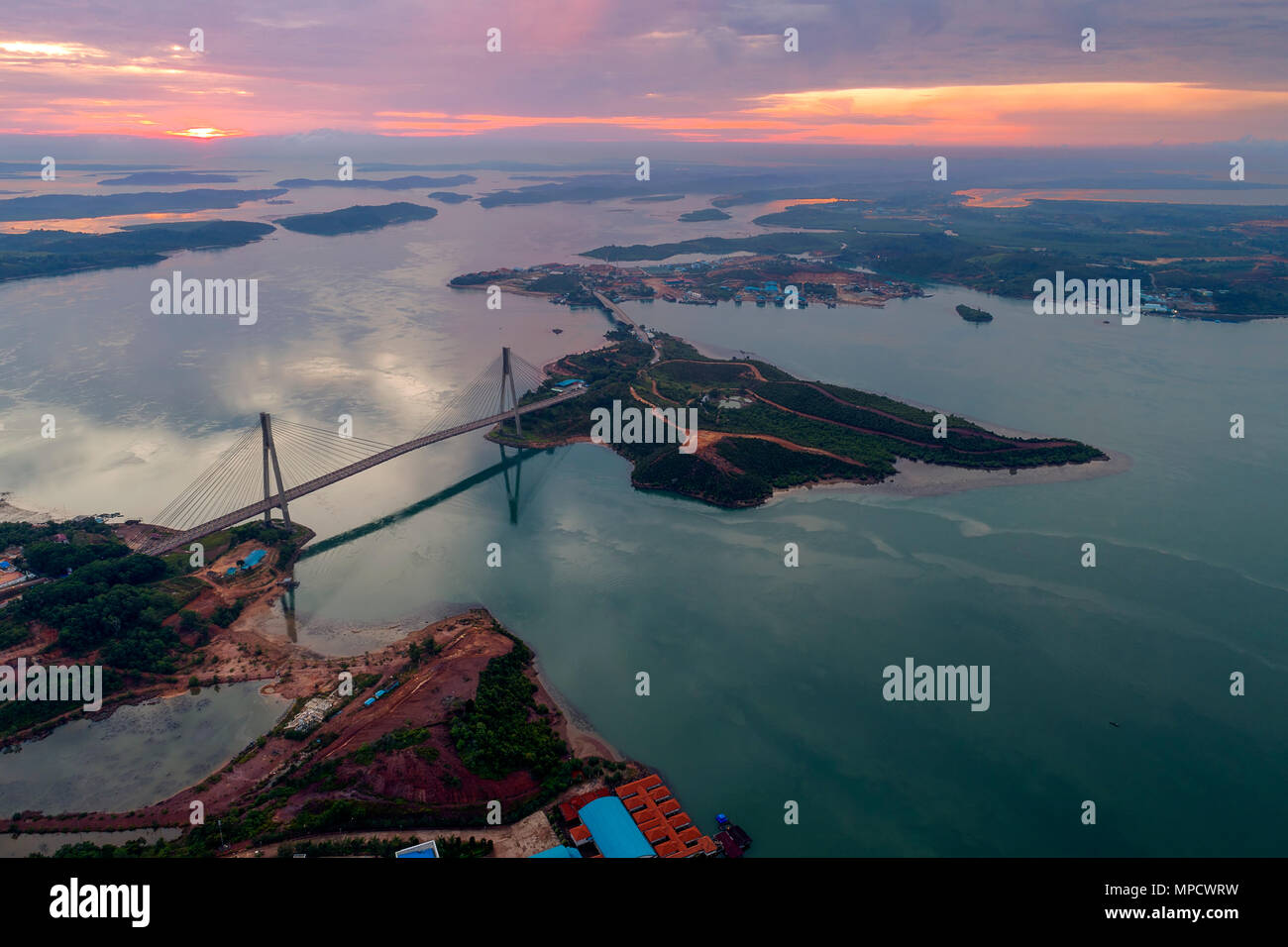 Aerial view of Barelang Bridge a chain of six bridges of various types that connect the islands of Batam at sunrise, Indonesia Stock Photo