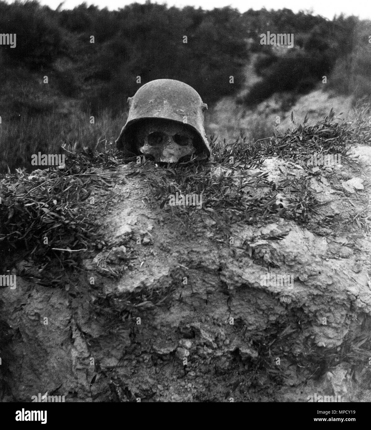 Human skull inside German military helmet World War One Verdun France 1918 Stock Photo
