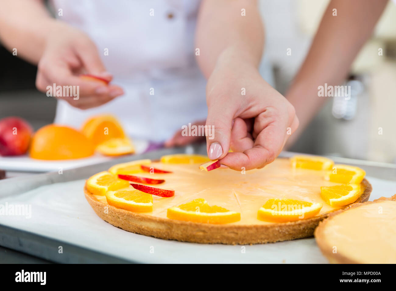 Fruit cakes being made by two pastry bakers Stock Photo - Alamy