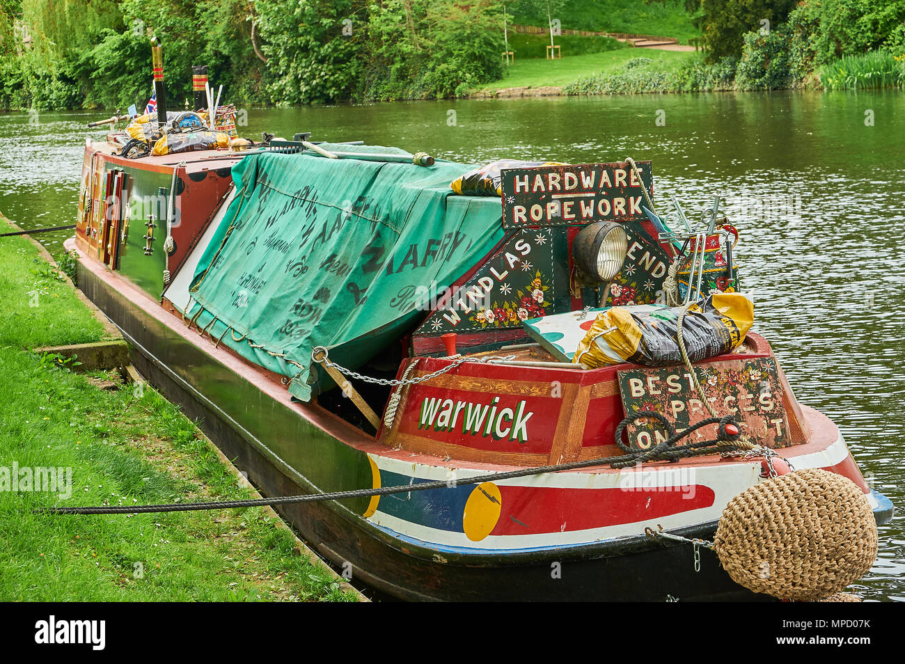 Stratford upon Avon and a traditional canal narrow boat moored on the River Avon. Stock Photo
