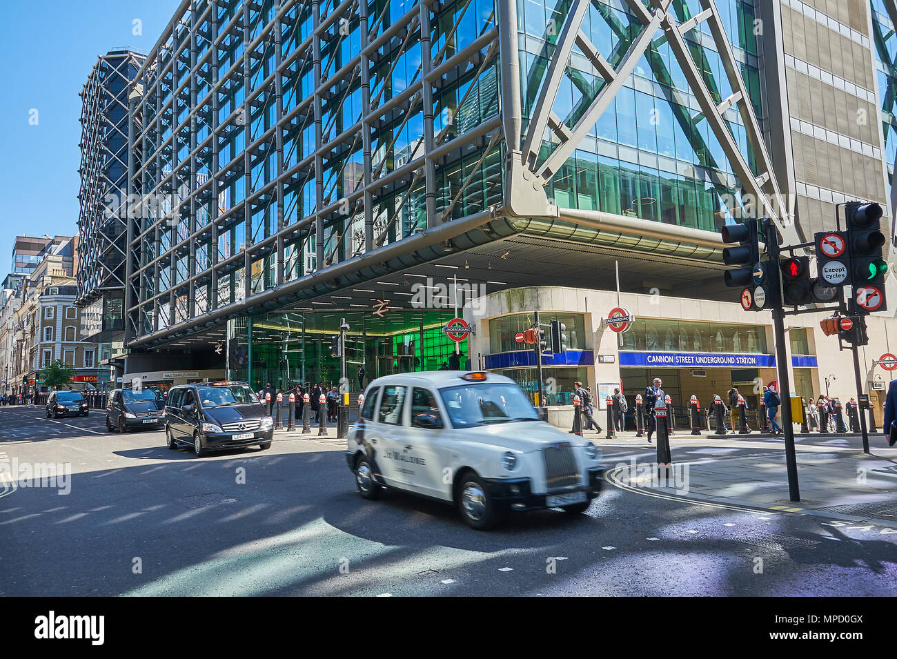 London Cannon Street railway station and passing iconic London taxi's Stock Photo