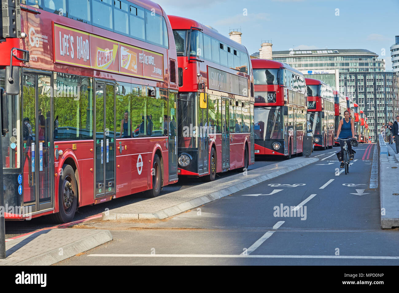 London Westminster Bridge and a line of red double decker buses Stock Photo