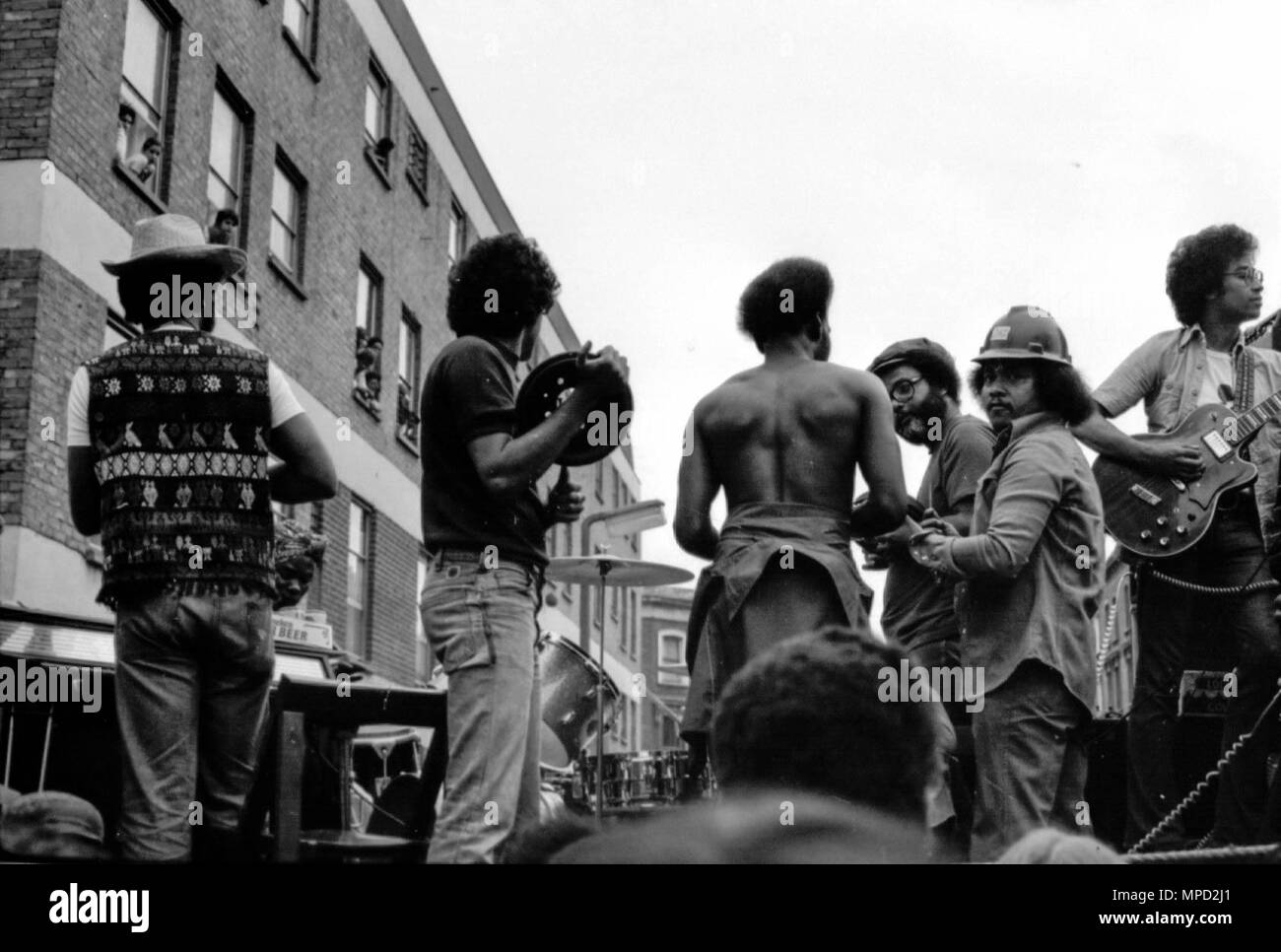 The Notting Hill Carnival in the streets of West London in 1976, the largest street festival in Europe. In this photo are The Iron Men who often play at J'ouvert, a large street party in Trinidad. Great history of the Carnival images. Stock Photo