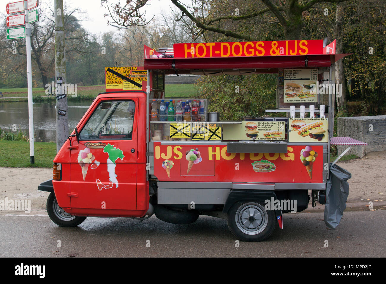 Amsterdam, Netherlands-november 8, 2015: vespa piaggio ape 50 hot dog car in the vondelpark in Amsterdam Stock Photo