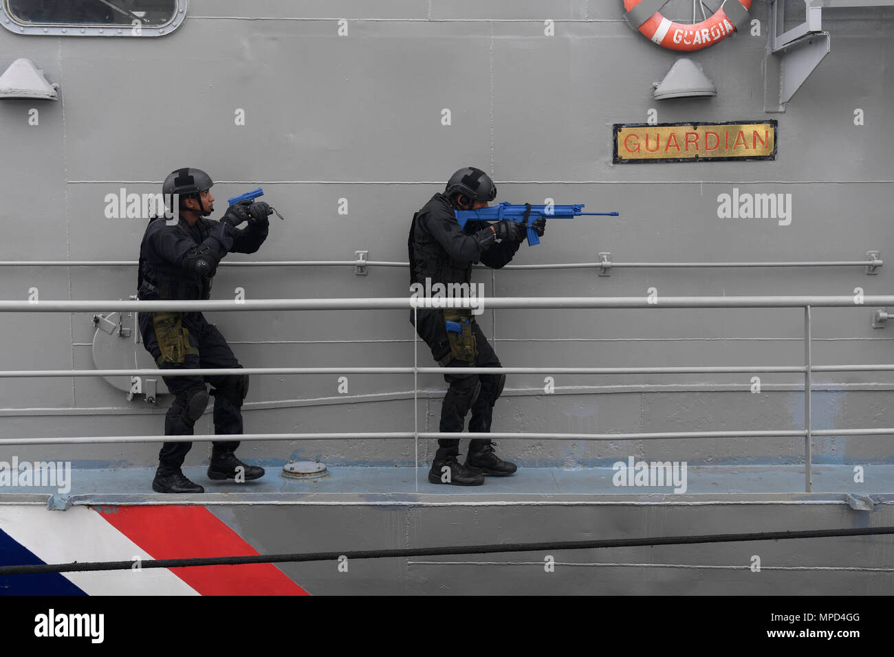 https://c8.alamy.com/comp/MPD4GG/mauritius-national-coast-guard-commandos-participate-in-visit-board-search-and-seizure-training-aboard-mauritius-coast-guard-ship-guardian-during-exercise-cutlass-express-2017-in-port-louis-mauritius-feb-5-2017-exercise-cutlass-express-2017-sponsored-by-us-africa-command-and-conducted-by-us-naval-forces-africa-is-designed-to-assess-and-improve-combined-maritime-law-enforcement-capacity-and-promote-national-and-regional-security-in-east-africa-us-navy-photo-by-mass-communication-specialist-1st-class-justin-stumberg-MPD4GG.jpg