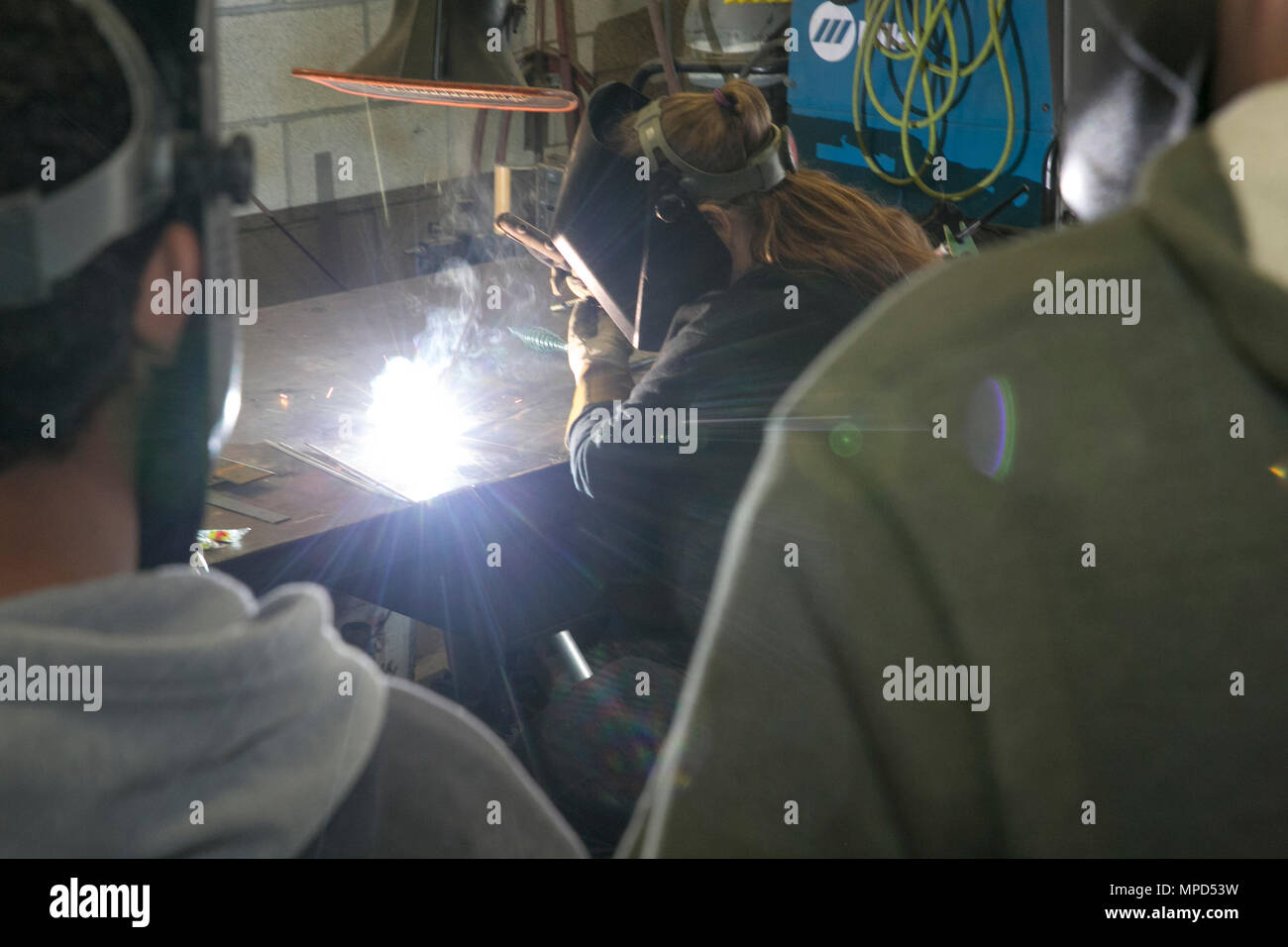 Leslie Hundley, welder, Exercise Support Division, demonstrates how to