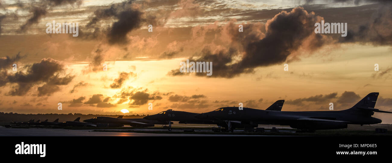 U.S. Air Force B-1B Lancers assigned to the 9th Expeditionary Bomb Squadron, deployed from Dyess Air Force Base, Texas, and the 34th EBS, assigned to Ellsworth Air Force Base, S.D., sit beside one another on the flightline Feb. 6, 2017, at Andersen AFB, Guam. The B-1B’s speed and superior handling characteristics allow it to seamlessly integrate in mixed force packages. These capabilities, when combined with its substantial payload, excellent radar targeting system, long loiter time and survivability, make the B-1B a key element of any joint/composite strike force. The 9th EBS is taking over U Stock Photo