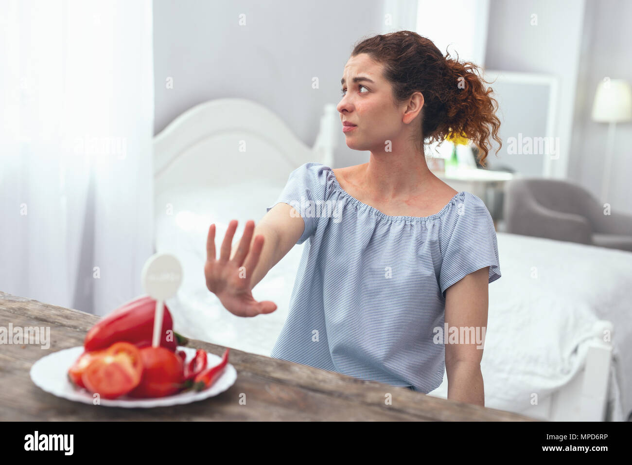 Young girl being allergic to vegetables Stock Photo Alamy