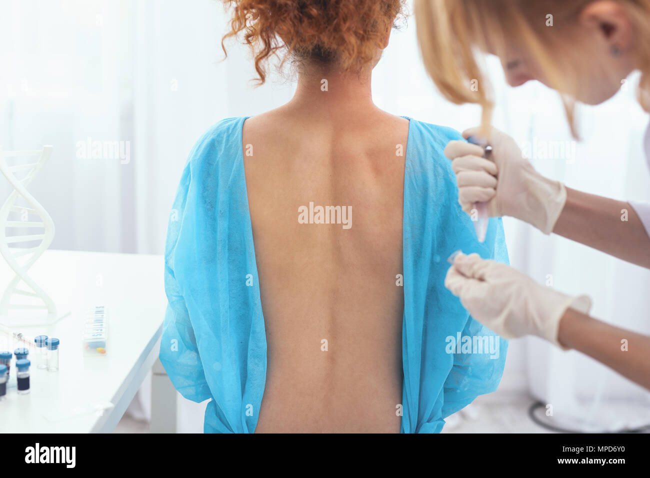 Cutaneous Sample Professional doctor taking patients skin sample Stock Photo - Alamy