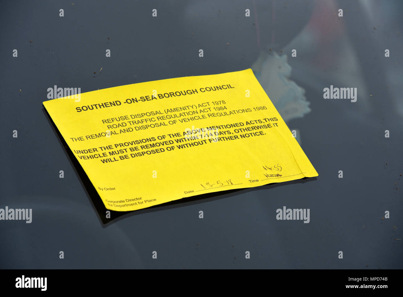 Warning notice issued by Southend on Sea Borough Council to dispose of a car vehicle parked on public highway. Refuse disposal amenity act. Windsceen Stock Photo