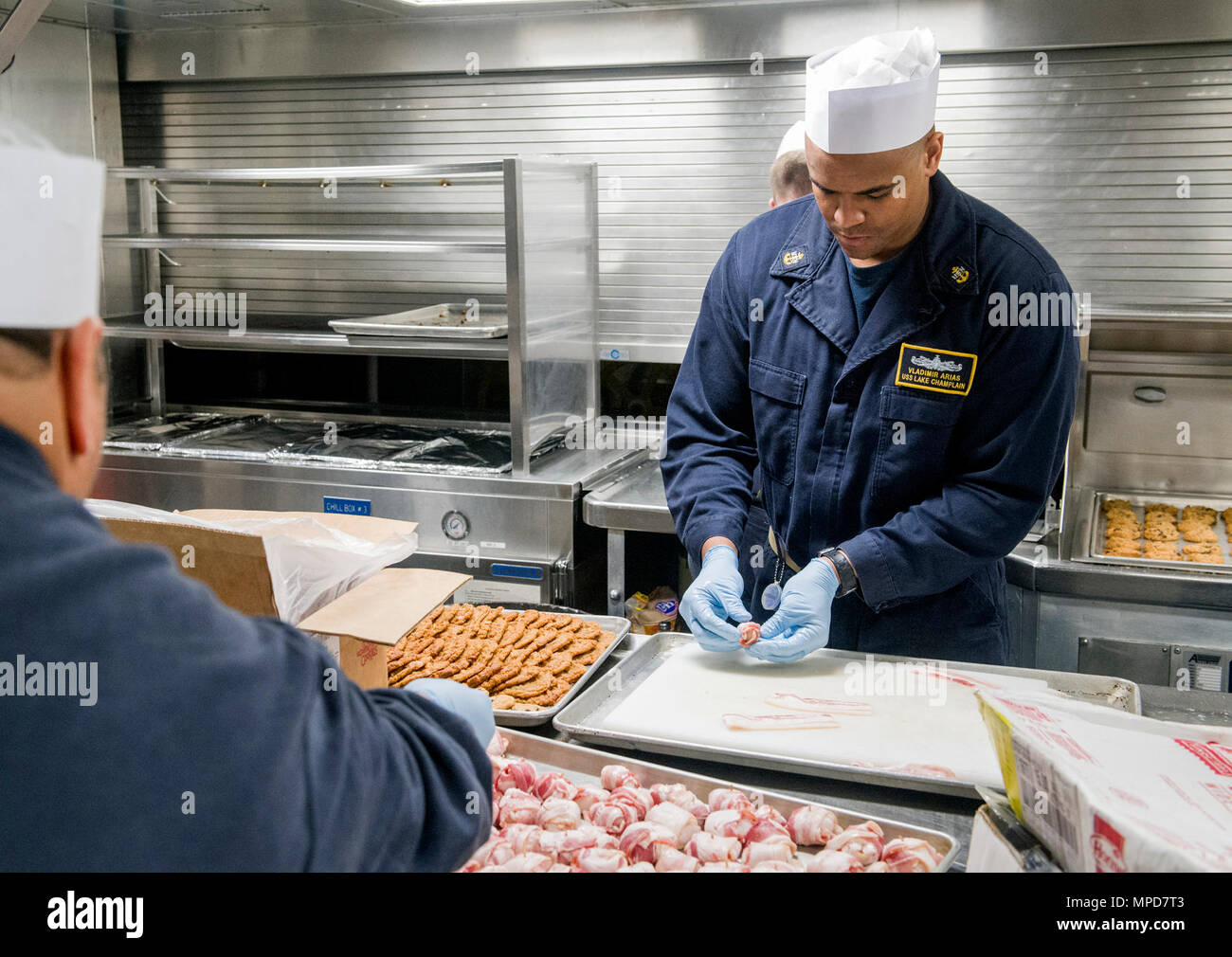 Sailors aboard the Ticonderoga-class guided-missile cruiser USS Lake ...