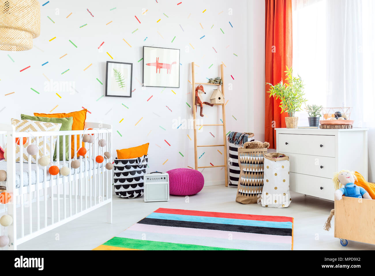 Baby room with white dresser, cot and carpet Stock Photo Alamy
